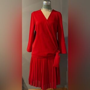 Ann Taylor Red 2 pc set. Pleated skirt size 12 Faux wrap top side tie size Large